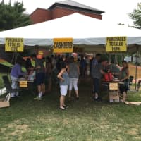 <p>Under the tent is the cool place to be at the Westport Library Book Sale on Saturday. The sale continues on Sunday.</p>