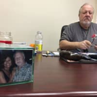 <p>Galloway keeps a picture of himself with his wife, Maria, right on his desk.</p>