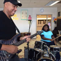 <p>Yankees legend Bernie Williams jams with students at Tisdale School March 7.</p>
