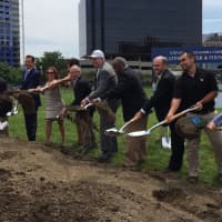 <p>Alexandra Cohen, third from left, joins Gov. Dannel Malloy, Stamford Mayor David Martin and other city officials at the groundbreaking for the new rink in Mill River Park.</p>