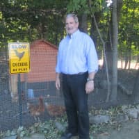 <p>Rabbi Steven Kane stands in front of CSI&#x27;s new chicken farm.</p>