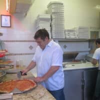 <p>Tony Arpaia gets ready to serve up a slice at Lucy&#x27;s in Ossining.</p>