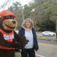 <p>The Briarcliff Bear and event organizer Debbie Johnson at the Ragamuffin parade.</p>