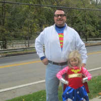 <p>Superman and Wonder Woman team up at the Briarcliff Ragamuffin Parade.</p>