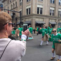 <p>A mom snaps a photo of marchers from Fairfield&#x27;s St. Thomas Aquinas School at 2016 St. Patrick&#x27;s Day Parade in Bridgeport.</p>