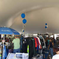 <p>A tent is filled with nautical gear at the Norwalk Boat Show.</p>