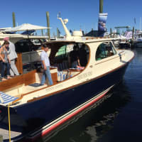 <p>Checking out one prize — in the water — at the Norwalk Boat Show.</p>