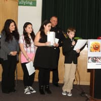 <p>Kids read their drug prevention messages at the Courage to Speak Family Night.</p>