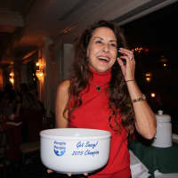 <p>Debbie Bartoletta, board member for People to People, win&#x27;s Get Saucy award for best pasta sauce.</p>