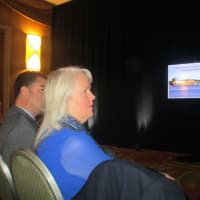<p>Cortlandt Supervisor Linda Puglisi listens as Entergy announces plans to close Indian Point at a press conference.</p>