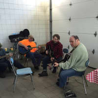 <p>Musicians hold a jam session at the Shelton Farmers Market Saturday.</p>