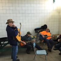 <p>Musicians hold a jam session at the Shelton Farmers Market Saturday.</p>