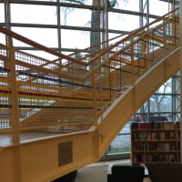 <p>Artist Katherine Daniels created an art installation of colorful plastic strips woven into the gridded surround of Greenwich Library&#x27;s grand stairs.</p>