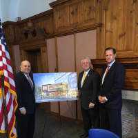 <p>Norwalk Mayor Rilling stands with a representative from the city and General Growth Properties Wednesday at the signing of the land disposition agreement for The SoNo Collection.</p>