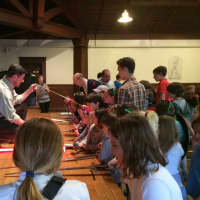 <p>Mark Silence, a theater teacher at Stamford&#x27;s King School, shows children a range of theater swords at the Shakespeare Family Festival at Fairfield&#x27;s Pequot Library.</p>
