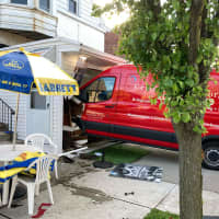 <p>A bright red van barreled through a service window of a brand new hot dog stand in Clifton.</p>