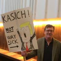 <p>John Mihalic of Fairfield makes his feelings known at a John Kasich Town Hall Meeting in Fairfield.</p>
