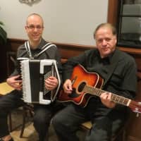 <p>Emilio Magnotta of White Plains on accordian and Tony Valenti of New City on guitar entertained about 200 guests during Wednesday&#x27;s grand re-opening of T&amp;J Restaurant and Pizzeria.</p>