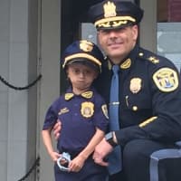 <p>Diego with Fairview Police CHief Martin Kahn</p>