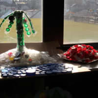 <p>Height, creativity and amount of bottle caps were the criteria that each structure was graded on. Many towers were built but some classes opted for a different approach, such as this tropical island recreation.</p>