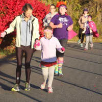 <p>Girls on the Run athletes and their buddies lap the track at 8 a.m.</p>