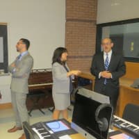 <p>Mamaroneck Mayor Norman Rosenblum, left, talks to music technology teacher Jeremy Franzé. Schools Superintendent Robert Shaps, far right, also toured the new eMusic Lab at Hommocks Middle School this week.</p>