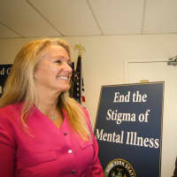 <p>Stephanie Madison and Glenn Liebman chatting before a press conference</p>