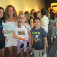 <p>Nirit Rosenblum and her family wait in line to see Hillary Clinton.</p>