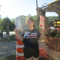 <p>A woman protests Hillary Clinton at the Chappaqua Library.</p>