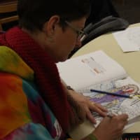 <p>Lodi Resident Genevieve Callahan colors a design of Sansa Stark from Game of Thrones.</p>