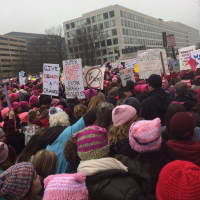 <p>With protest signs and pink hats, participants step off in the Women&#x27;s March On Washington.</p>