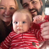 <p>Jared and Jessica Spingler with 1-year-old Liam.</p>