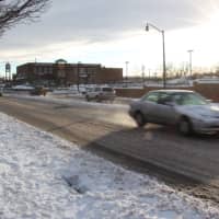 <p>Cars whip down plowed streets in Lodi.</p>