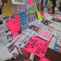 <p>Participants leave their signs behind in a giant wall on the mall at the Women&#x27;s March On Washington.</p>