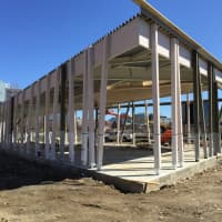 <p>Crews worked on the future Brownstein-Selkowitz Carousel Pavilion in Mill River Park Tuesday.</p>