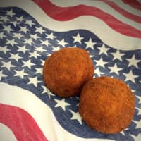 <p>Authentic Sicilian riceballs in a wide variety of flavors are the bread and butter of the Eat My Balls food truck.</p>