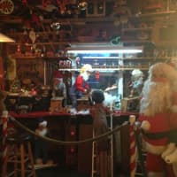 <p>Ossining resident Andre Platt creates a Santa workshop as part of his annual decorations.</p>