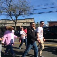 <p>Fairfield Police Chief Gary MacNamara struts down the Post Road at Walk a Mile in Her Shoes, an event to raise awareness of sexual assault and abuse.</p>