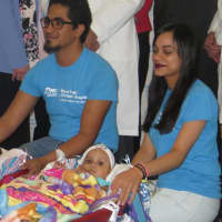 <p>Ballenie and Bellanie (right) clapped and watched reporters on Tuesday. They were separated during a 21-hour surgery last week. Here they are with their parents, Marino Abel Camacho and Laurilin Celadilla Marte, at Westchester Medical Center.</p>