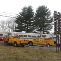 <p>Metropolitan Transportation Authority crews worked on a crossing gate on Friday, Jan. 27. A Metro-North spokesman said it may have been damaged by a motorist at the Commerce Street crossing in Valhalla.</p>