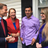 <p>Sen. Richard Blumenthal and Rep. Elizabeth Esty offer their support for Joel Colindrés, 33, and his wife, Samantha, 35, last week in New Fairfield.</p>