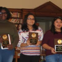 <p>From left to right, Port Chester High School poetry slam winners Mailynn Dempson, Karen Pantoja and Adriana Siguenza display their awards.</p>