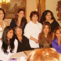 <p>De La Villa surrounded by some of her 22 grandchildren including Michelle Tavares, bottom left.</p>