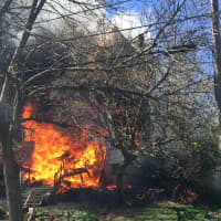 <p>Flames quickly engulfed the porch.</p>