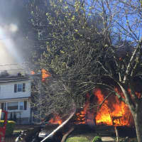 <p>Responders found the front porch engulfed.</p>