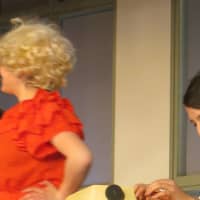 <p>Is that Dolly Parton? Close. It&#x27;s Elizabeth Montemurro playing Doralee Rhodes in &quot;9 to 5!&quot; at Port Chester High School. Ryan Heffernan (seated) plays the unlikeable boss, &quot;Mr. Hart,&quot; also known as Franklin Hart Jr.</p>