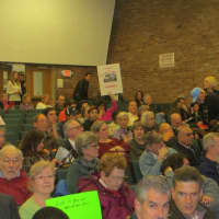 <p>More than 300 people packed King Street School in Port Chester on Wednesday for an &quot;Ask Astorino&quot; Town Hall meeting. Dozens of people held up red cards with the word &quot;No&quot; on them, waving them whenever they disagreed with an answer.</p>