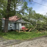 <p>A Carmel home had live wires and downed trees.</p>
