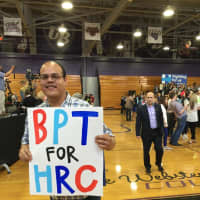 <p>Fernando Torres of Bridgeport holds up a sign at the Hillary Clinton campaign rally in Bridgeport Sunday.</p>