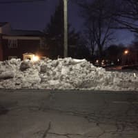 <p>A mound of snow seemingly created by a plow.</p>